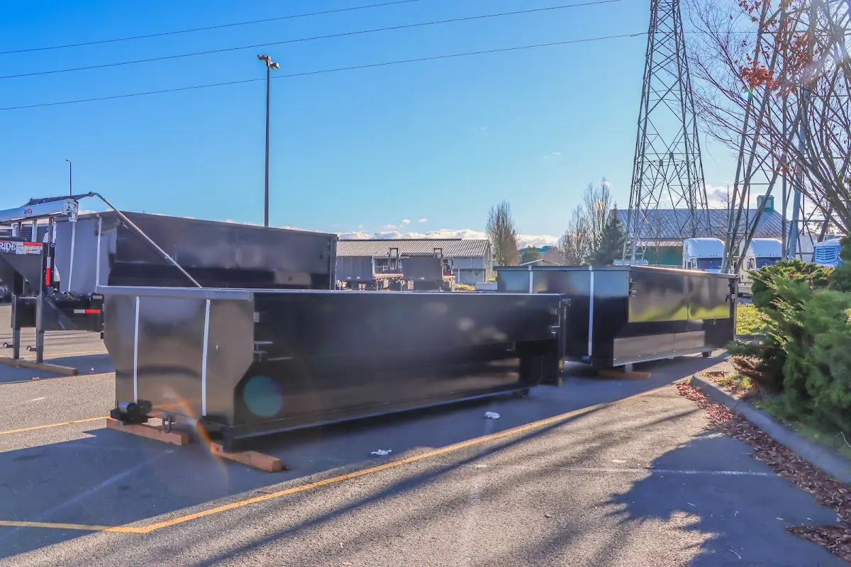 Roll-off dumpster ready for waste disposal at job site for Demolition Dumpster Rental in Southport